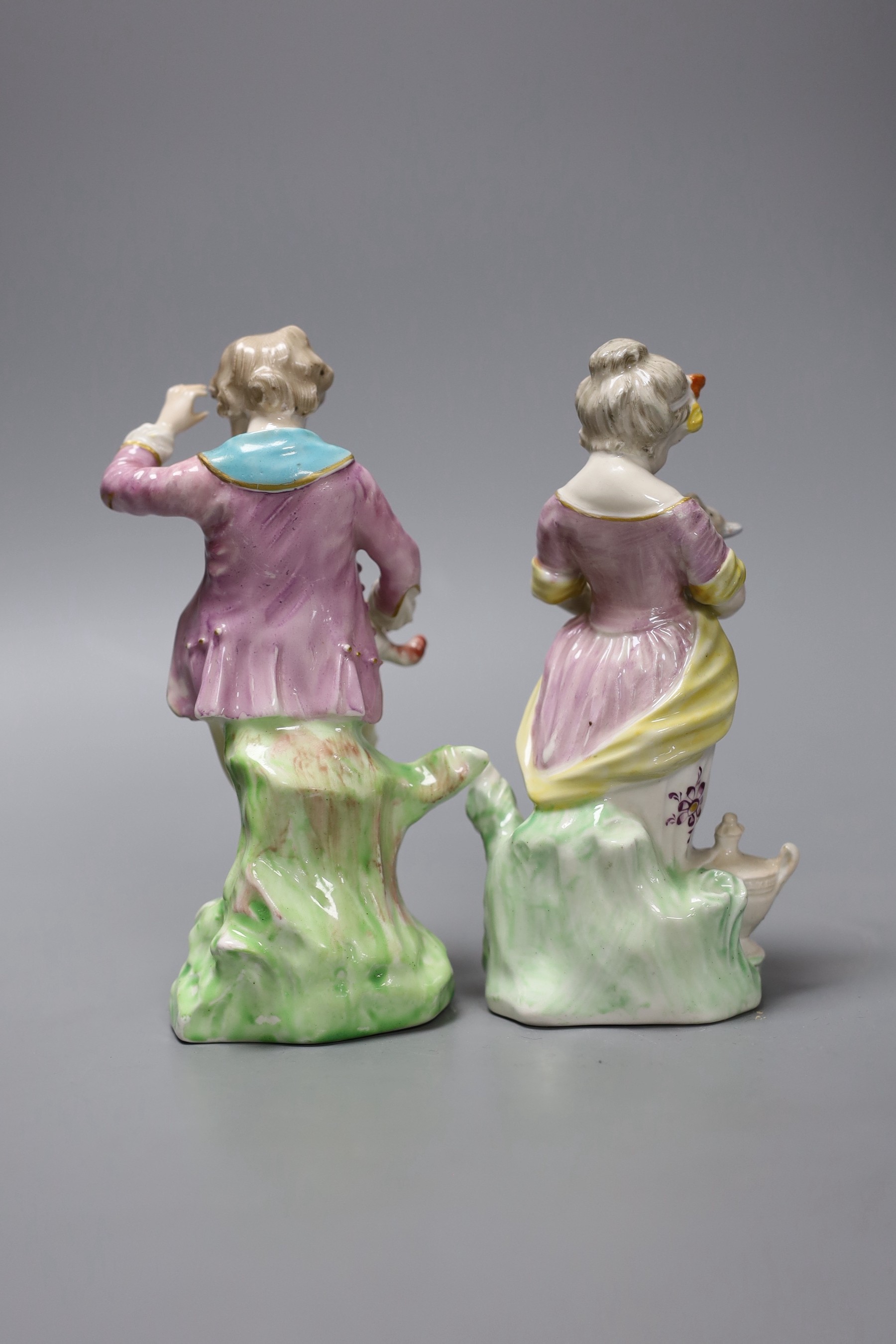 A pair of Chelsea Derby figures of a boy and a girl, she with a lamb and he with a dog, c.1775, 14.5cm